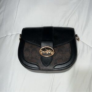 Coach saddle bag. Great condition, comes with strap!